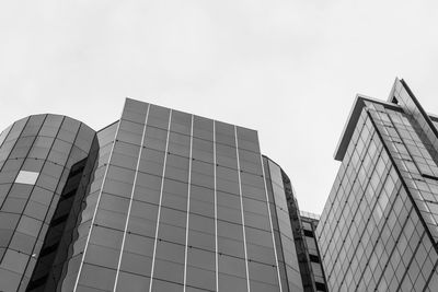 Low angle view of modern buildings against clear sky