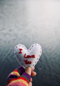 Close-up of hand holding heart shape ice cream