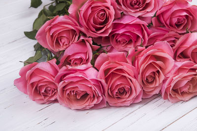 Close-up of pink roses on table