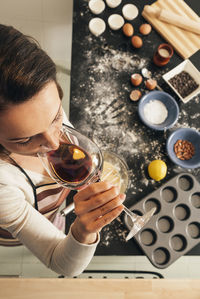 High angle view of woman having wine