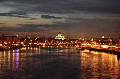 Illuminated city at waterfront