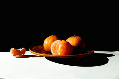 Close-up of fruits in plate on table