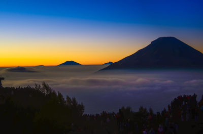 Scenic view of mountains against sky during sunset