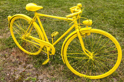 High angle view of bicycle parked on field