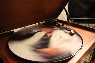 Close-up of spinning record player