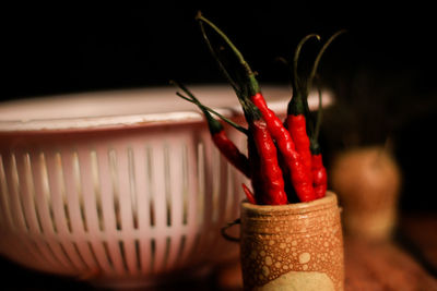 Close-up of red chili peppers on table