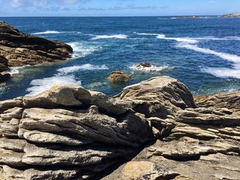 Scenic view of sea shore against sky