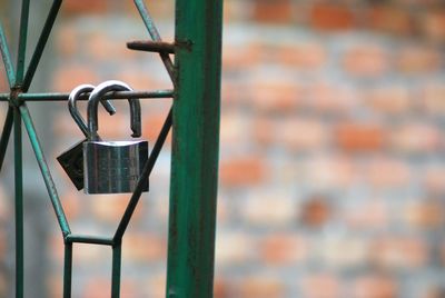 Close-up of padlock on wall