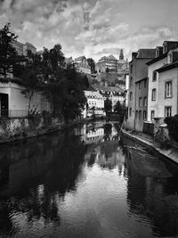 River amidst buildings in town