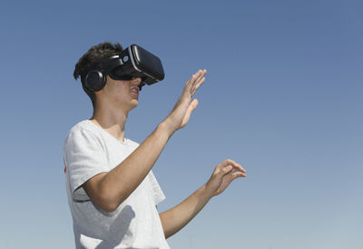 Virtual reality experience young man having a funny moment