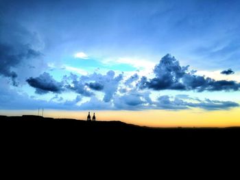 Silhouette of landscape against sunset sky