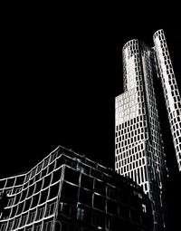 Low angle view of skyscrapers at night