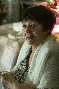 Portrait of woman sitting outdoors