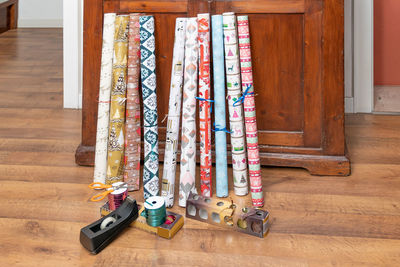 Christmas papers on hardwood floor at home