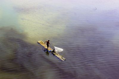 High angle view of people on boat sailing in river