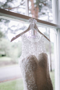 Low angle view of woman standing by window