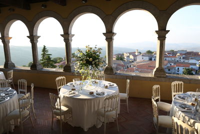 Table set for the wedding reception. plate cutlery and napkins, with flowers in the centerpiece