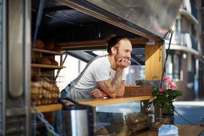 Full length of a man having food in restaurant