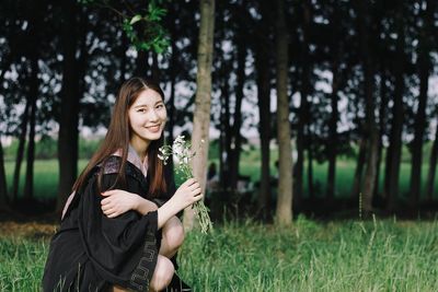 Portrait of young woman in forest