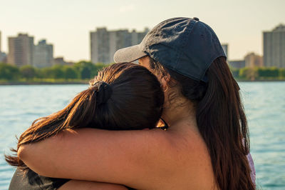 Rear view of woman wearing hat outdoors