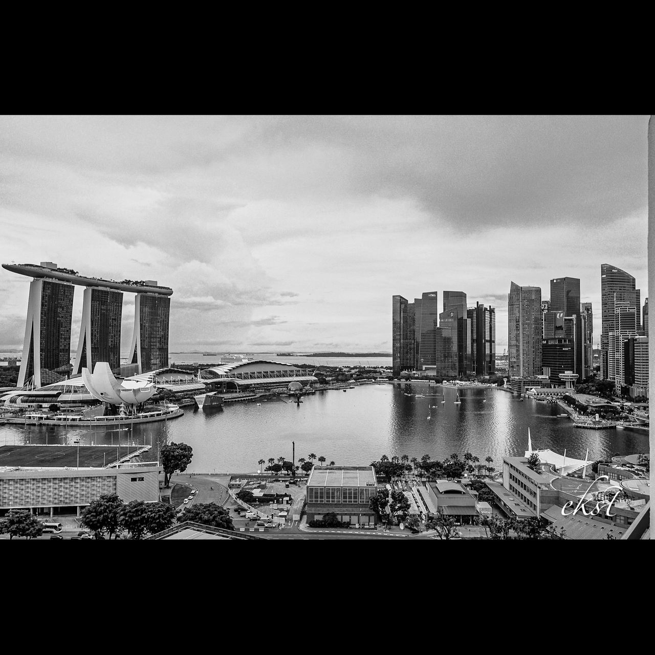 architecture, black and white, built structure, building exterior, city, skyline, sky, water, monochrome photography, building, office building exterior, cityscape, skyscraper, monochrome, urban skyline, nature, travel destinations, cloud, landscape, no people, sea, outdoors, transportation, travel, ship, nautical vessel, city life, metropolis, day, residential district