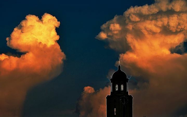 building exterior, architecture, built structure, low angle view, sky, cloud - sky, religion, spirituality, place of worship, church, tower, cloudy, sunset, high section, silhouette, cloud, outdoors, dusk