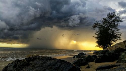 Scenic view of sea against dramatic sky