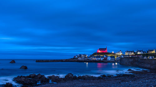 The red church in findochty on high land overlooking the small fishing village on the moray coast