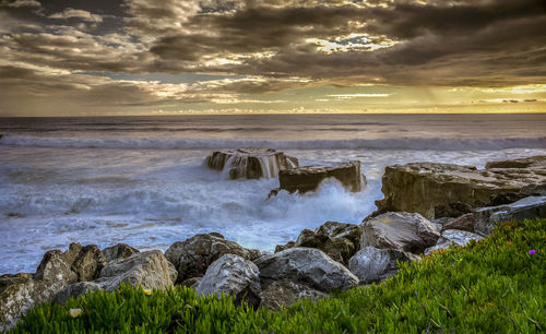 Scenic view of sea against cloudy sky