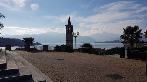 Panoramic view of beach by building against sky