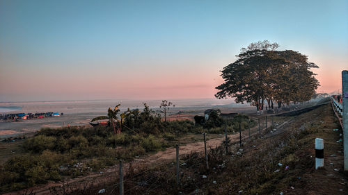 Scenic view of sea against clear sky during sunset