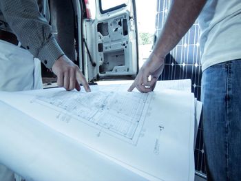 Close-up of man working on paper