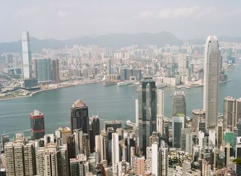 Aerial view of city and buildings against sky