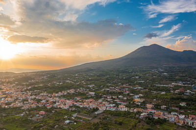 Aerial view of townscape against sky during sunset