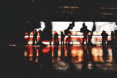 Silhouette people standing in shopping mall