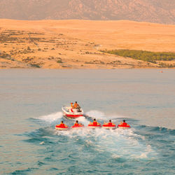 People in boat on sea