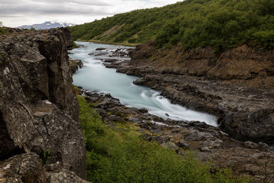 Stream flowing through rocks