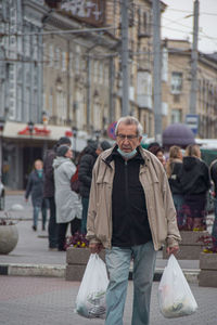 Man walking on street in city