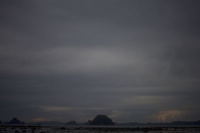 Scenic view of land against sky during sunset