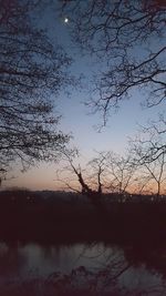 Scenic view of lake at sunset