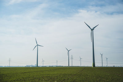 Wind turbines on field