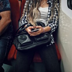 Close-up of man using mobile phone