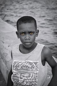 Portrait of boy standing outdoors