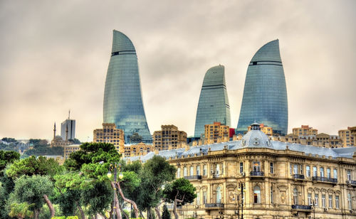 View of buildings against cloudy sky