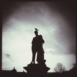 Low angle view of statue against sky