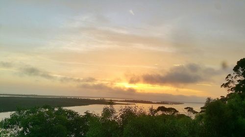 Scenic view of sea against sky at sunset