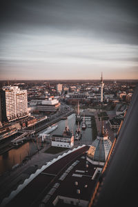 High angle view of road amidst buildings in city against sky