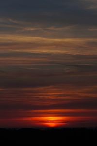 Scenic view of dramatic sky during sunset