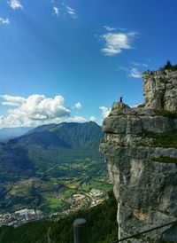 Scenic view of landscape against cloudy sky