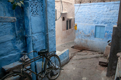 Bicycle on wall of old building